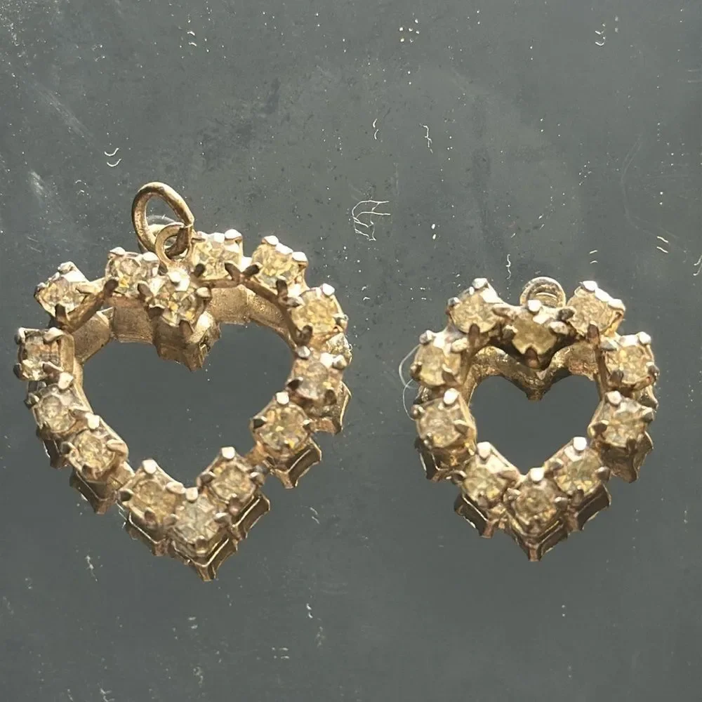 Two vintage rhinestone heart pendants